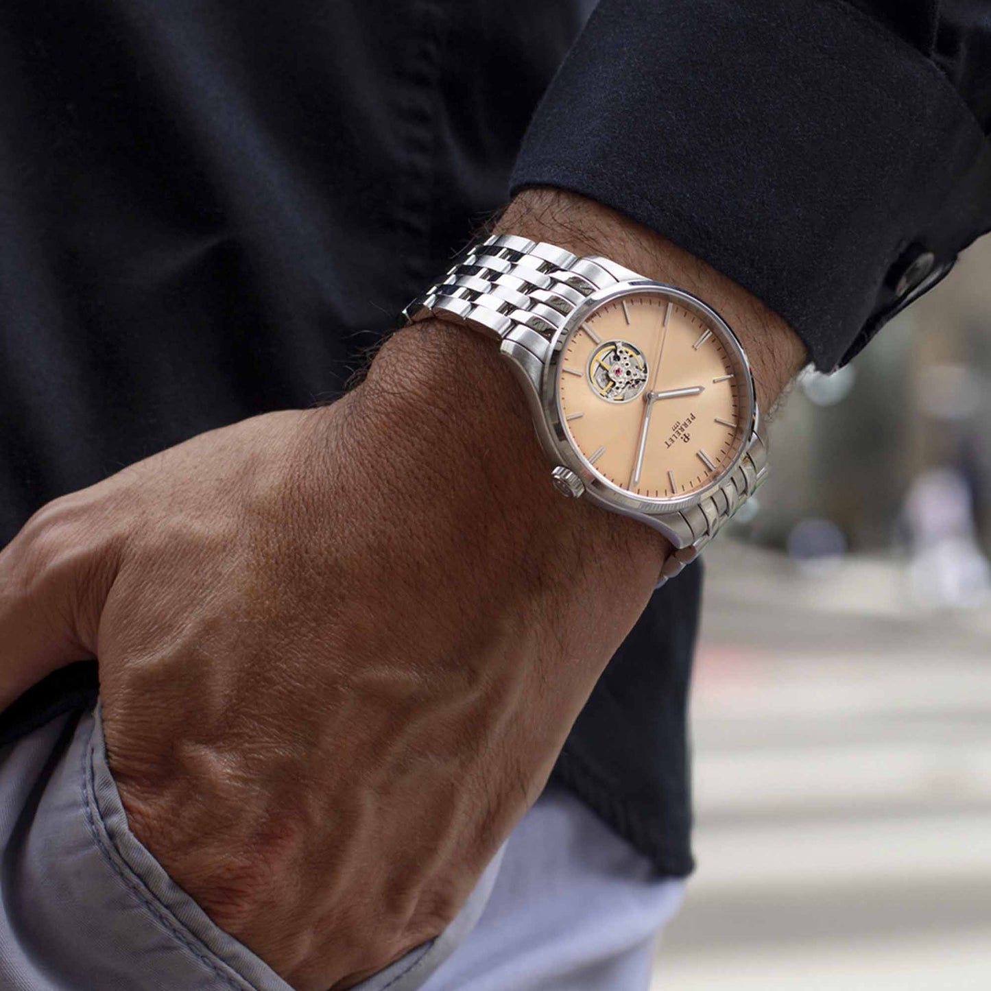 WEEKEND Open Heart A1302/D pairs a salmon dial with exposed mechanics for an elegant yet distinctive look.