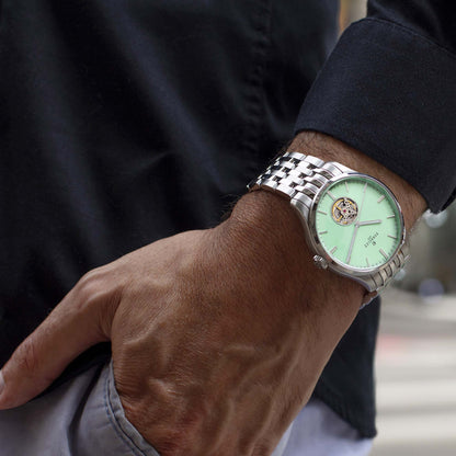 WEEKEND Open Heart A1302/B blends mint green tones with visible mechanics and classic Swiss craftsmanship.