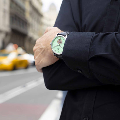 WEEKEND Open Heart A1302/C blends modern mint tones with visible mechanics for a fresh take on classic Swiss watchmaking.