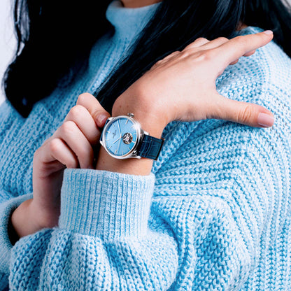 WEEKEND Open Heart A1302/A blends classic style with an ice blue dial and exposed movement for refined wrist presence.